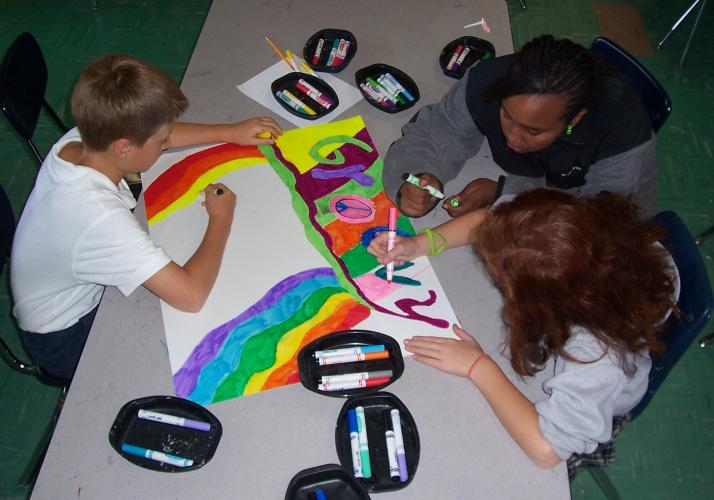 Students working on "May Madness" posters