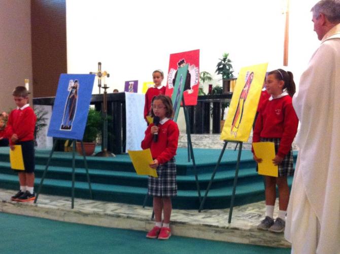 3rd grade taught us about many saints at their All Saints Day Mass